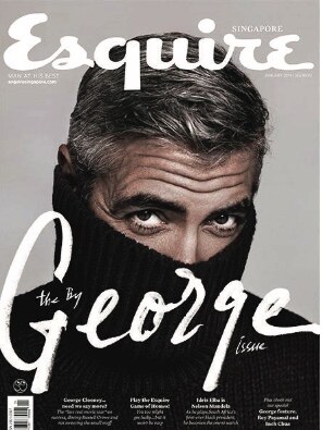 Editorial placeholder image: a magazine cover with a man in a black roll-neck pulled up over his chin, printed in black and white.